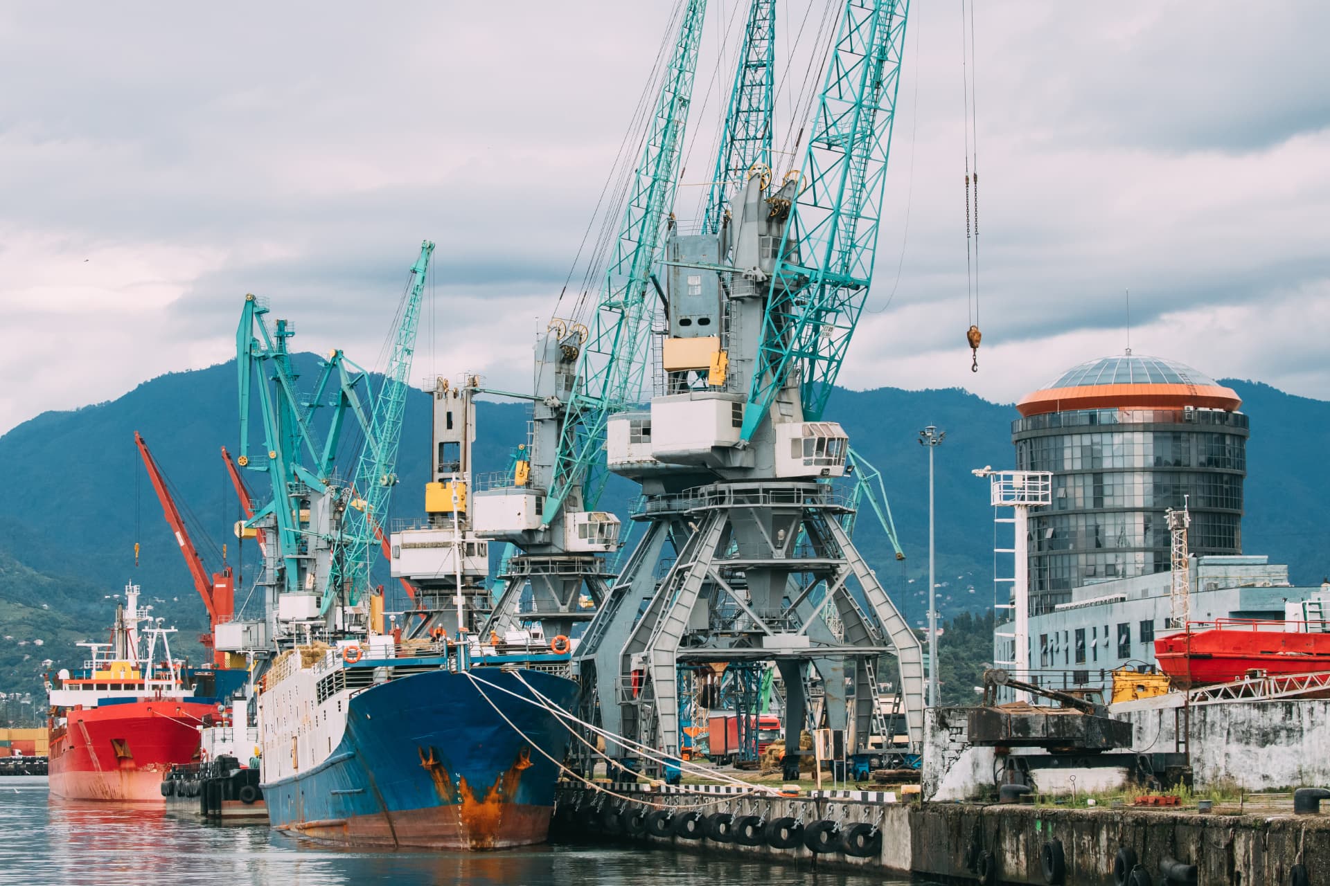 Cargo ships and cranes at an industrial harbour
